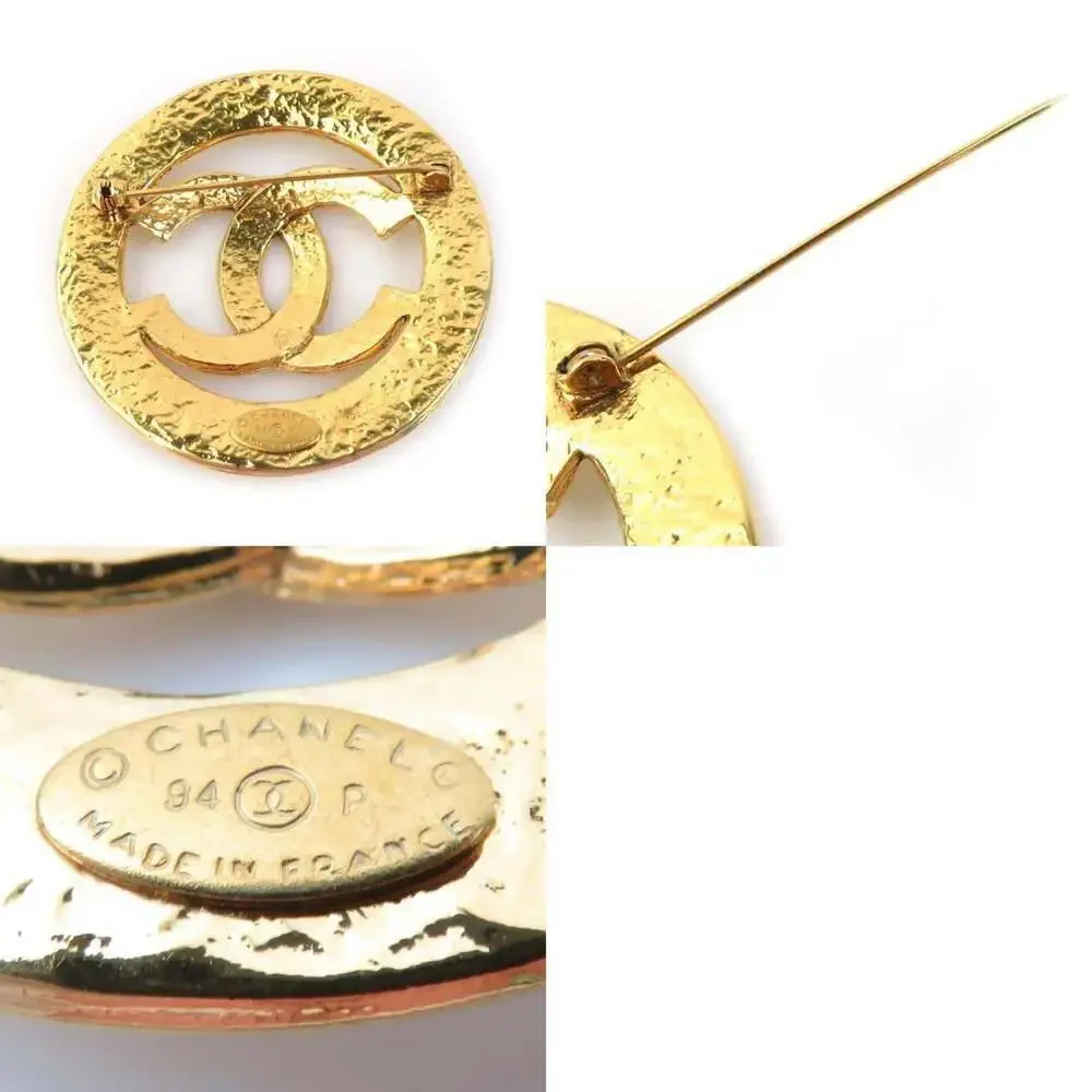 CHANEL Gold Logo Brooch